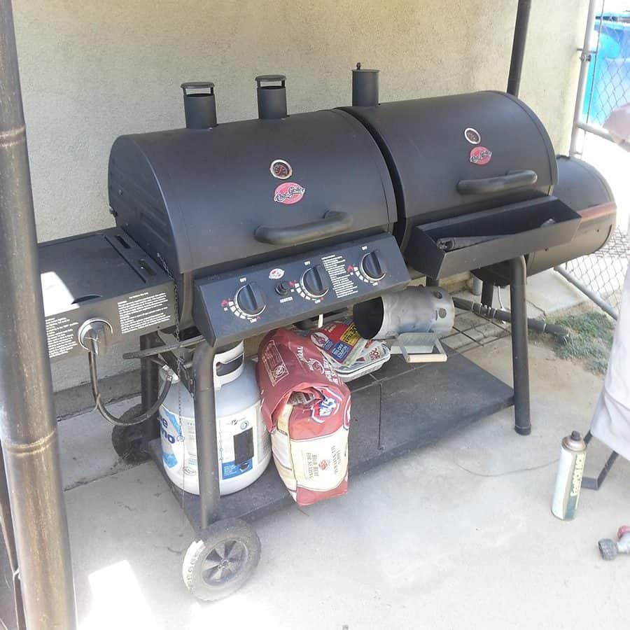 A smoker grill combo cart design on wheels