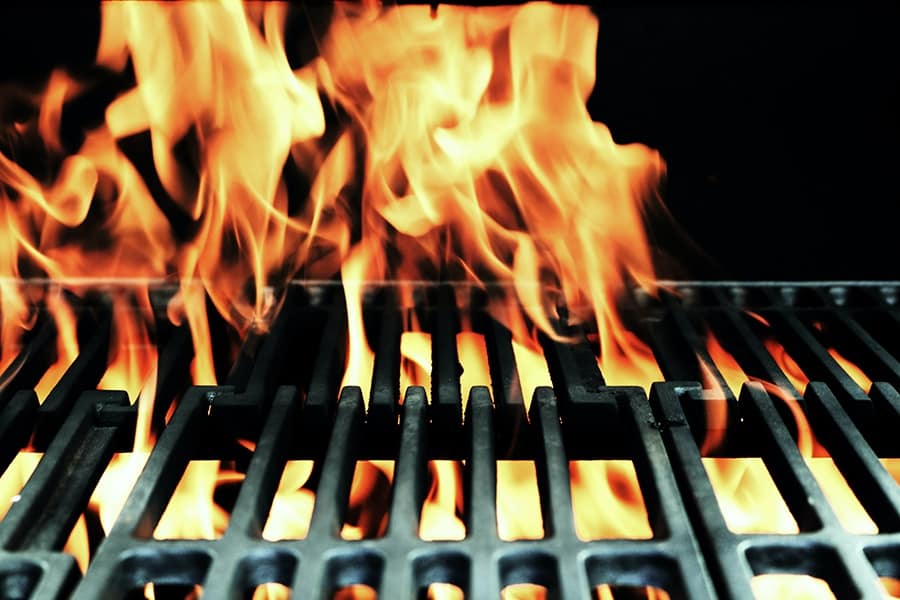 fire burning through cast iron grates