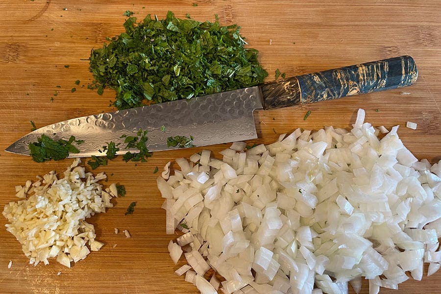 Japanese chef knife chopping vegetables